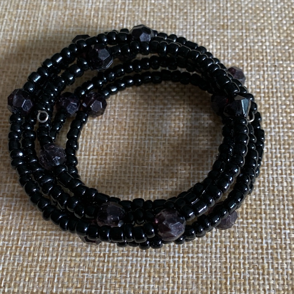 Black memory wire snake bracelet. Goth or dark academia.